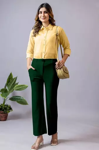 women solid dark green regular fit mid-rise flat front trousers