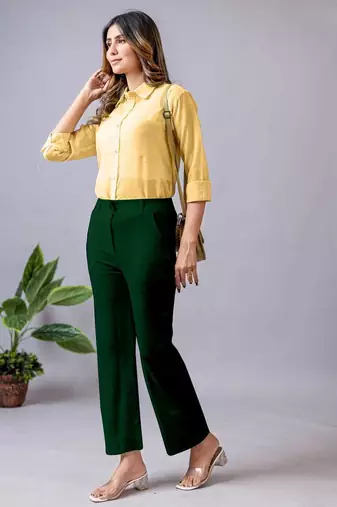 women solid dark green regular fit mid-rise flat front trousers