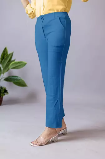 women solid blue regular fit mid-rise flat front trousers