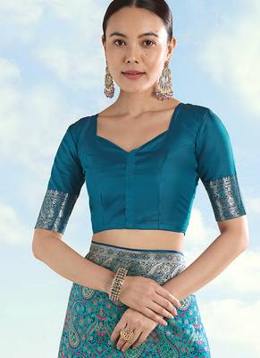 Turquoise faux banarasi silk blend saree with traditional paisley weaves 6