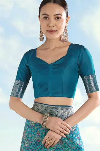 Turquoise faux banarasi silk blend saree with traditional paisley weaves
