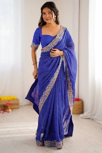 Blue color faux georgette bandhni print & embroidered border saree