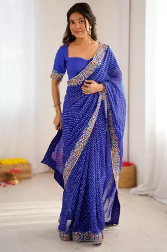 Blue color faux georgette bandhni print & embroidered border saree