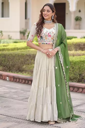 white cosmos silk lehenga choli with green embroidered dupatta