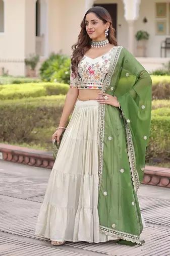 white cosmos silk lehenga choli with green embroidered dupatta