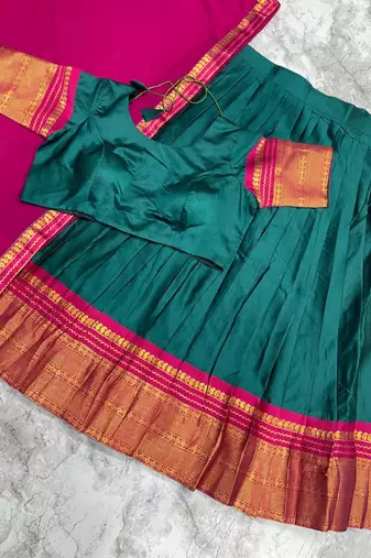 dark green kanjivaram silk half saree with gold zari weaving