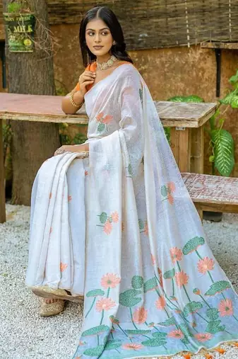 white orange muga silk saree with floral weaving work