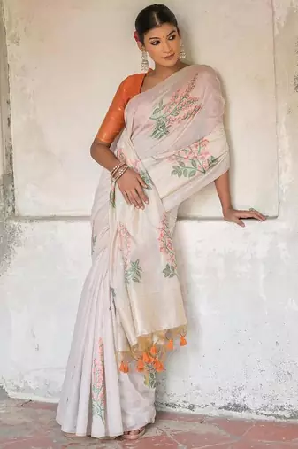 white orange cotton saree with zari patta floral woven pattern