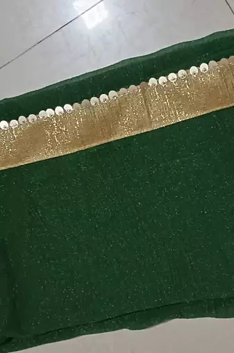 Green sequenced lace chiffon gerogette bollywood saree with blouse piece.