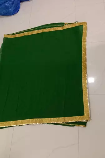 Green sequenced lace chiffon gerogette bollywood saree with blouse piece.