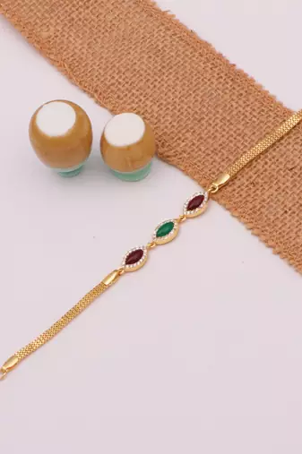 gold metal bracelet with traditional design