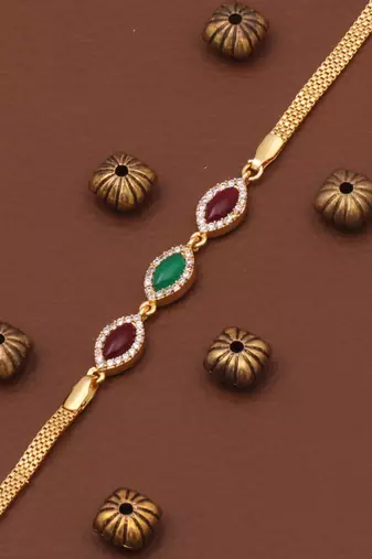 gold metal bracelet with traditional design