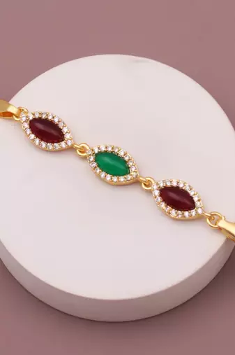 gold metal bracelet with traditional design