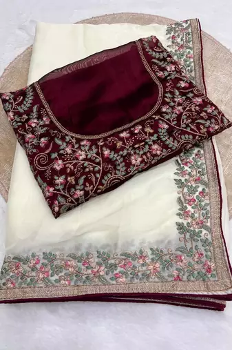 white silk saree with embroidery and zari work