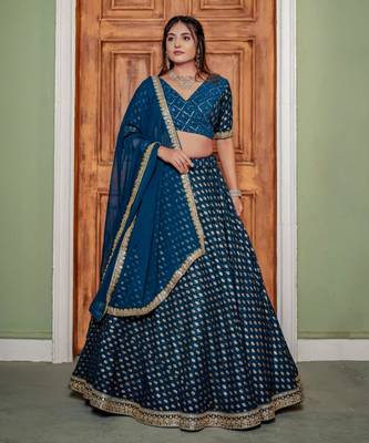 teal georgette lehenga with embroidered border design
 1