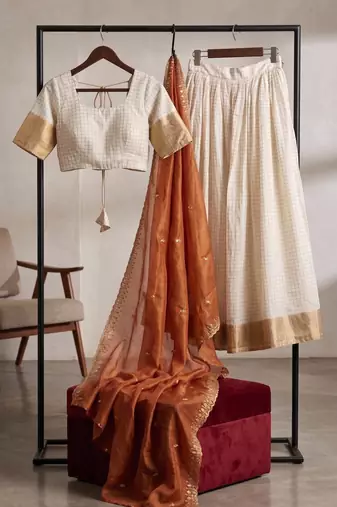 cream silk blend lehenga with gold embroidery