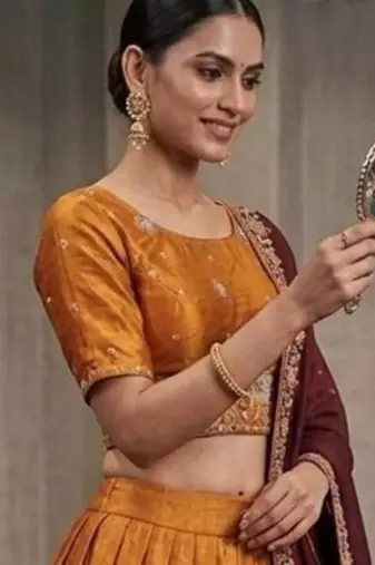 orange silk blend lehenga with peacock embroidery