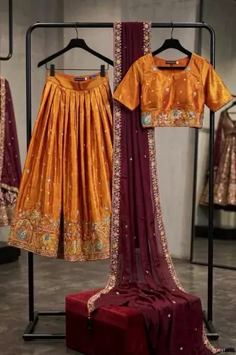 orange silk blend lehenga with peacock embroidery
