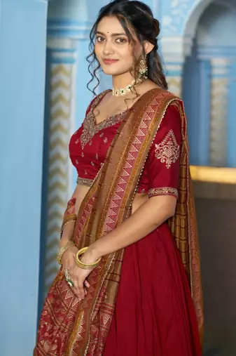 red silk blend lehenga set with gold border embroidery