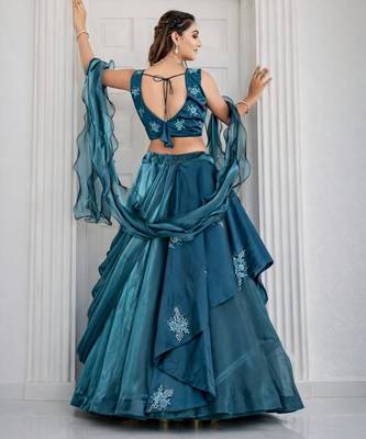 teal silk blend lehenga set with layered tier design
 2