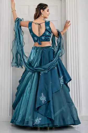 teal silk blend lehenga set with layered tier design