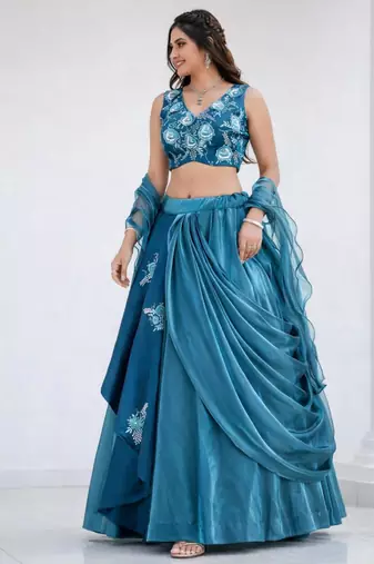 teal silk blend lehenga set with layered tier design