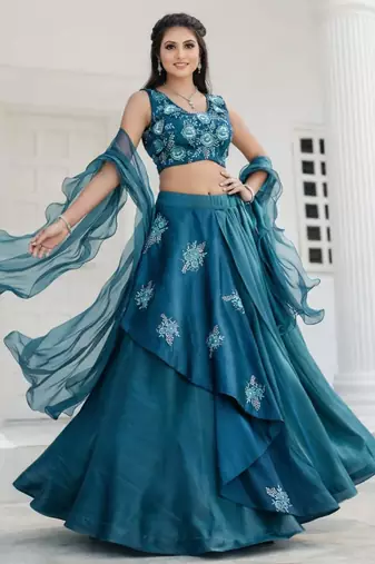 teal silk blend lehenga set with layered tier design