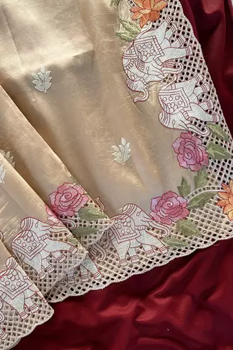 Beige Color embrodied elephant design panel with cutwork and hole work art silk saree