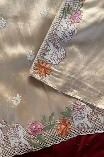 Beige Color embrodied elephant design panel with cutwork and hole work art silk saree