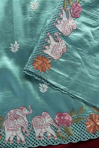 Blue Color embrodied elephant design panel with cutwork and hole work art silk saree