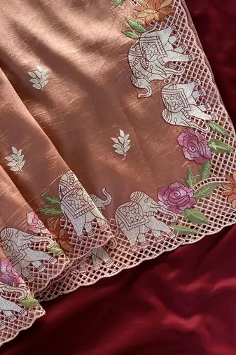 Peach Color embrodied elephant design panel with cutwork and hole work art silk saree