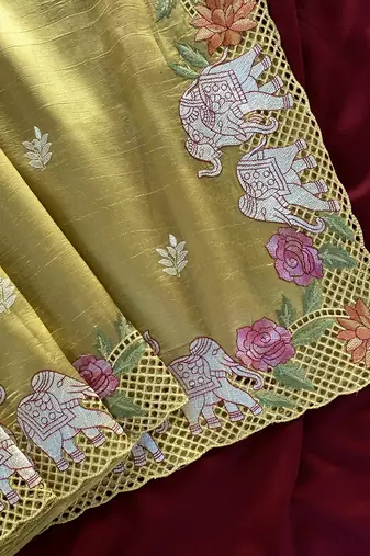 Yellow Color embrodied elephant design panel with cutwork and hole work art silk saree