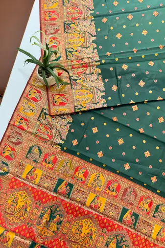 dark green banarasi silk saree with butti design