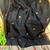 Black color pure zari and meena weaving linen silk saree