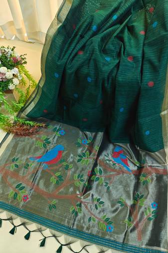 Dark green color pure zari and meena weaving linen silk saree