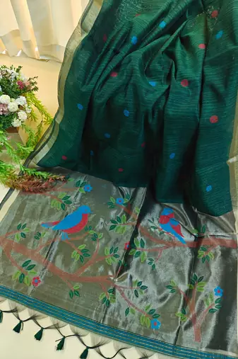 Dark green color pure zari and meena weaving linen silk saree