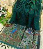 Dark green color pure zari and meena weaving linen silk saree
