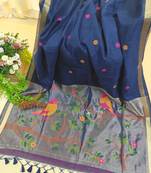 Navy blue color pure zari and meena weaving linen silk saree