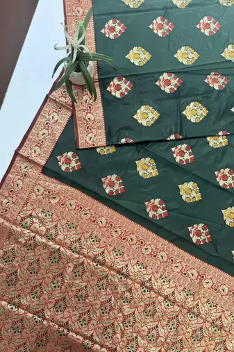 dark green banarasi silk saree with designer woven pallu