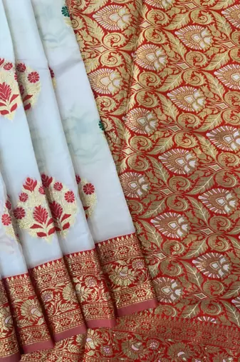 white banarasi silk saree with contrast zari buttis