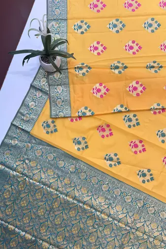 yellow banarasi silk saree with zari woven border