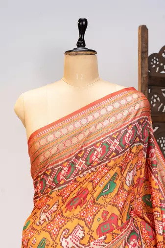 orange patola design and silver coin weaving pure patola silk saree
