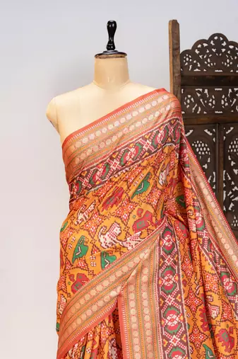 orange patola design and silver coin weaving pure patola silk saree