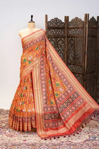 Orange color patola design and silver coin weaving pure patola silk saree