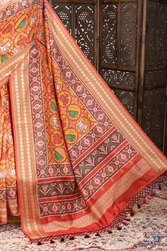 orange patola design and silver coin weaving pure patola silk saree