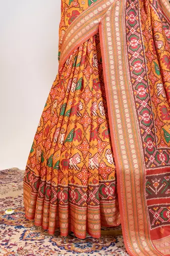 orange patola design and silver coin weaving pure patola silk saree