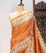 Orange color warli printed tissue tussar silk saree