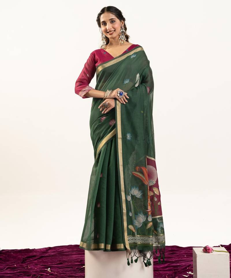 Dark green color lotus , musa and zari weaving  muga cotton saree