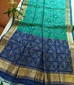 Aqua blue color resham and zari weaving raw silk pochampali ikkat saree