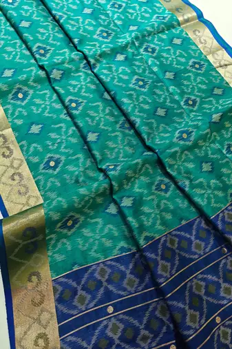 aqua blue raw silk pochampally ikkat saree with zari border